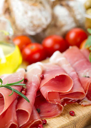 sliced prosciutto and vegetablesの写真素材