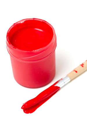 red gouache and wooden brush isolated on whiteの写真素材