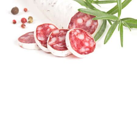 sliced salami isolated on white backgroundの写真素材
