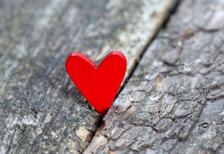 red hearts on rustic wooden surfaceの写真素材