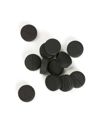 brown capsule pills isolated on whiteの写真素材