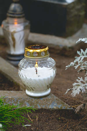 candles and flowers at cemeteryの写真素材