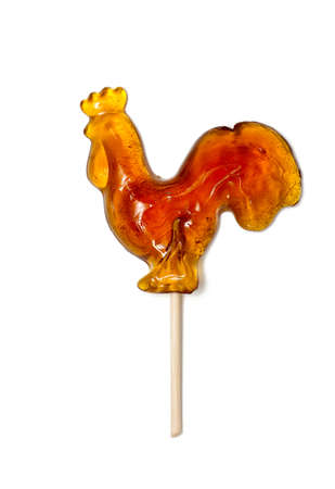 Russian lollipop in the form of rooster on white backgroundの写真素材