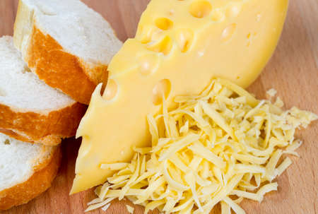 grated cheese on wooden table