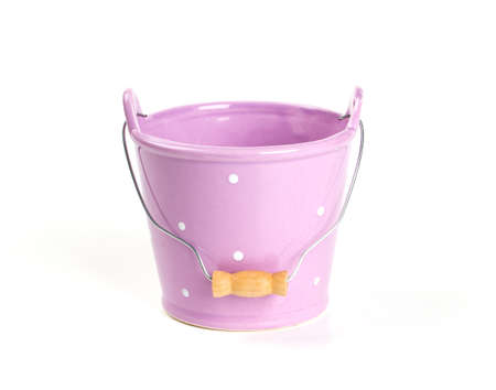 violet ceramic bucket isolated on whiteの写真素材
