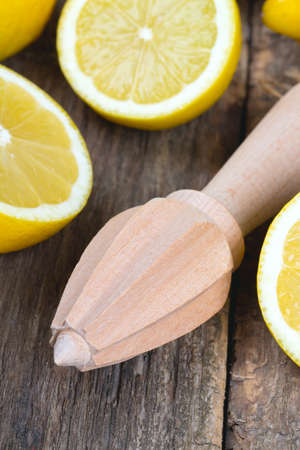 lemon juicer on an old wooden tableの写真素材