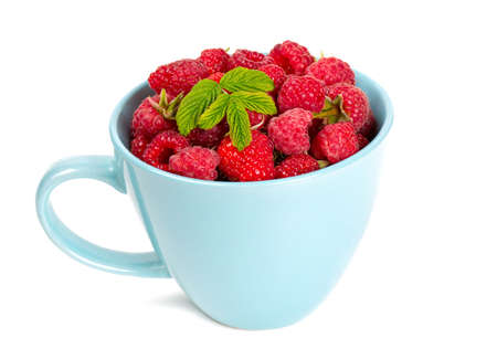 fresh raspberrie in a blue cupの写真素材