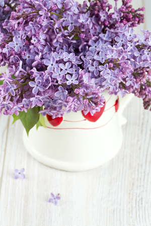 beautiful lilac on white wooden surfaceの写真素材