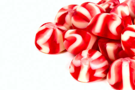 striped jelly candies isolated on whiteの写真素材