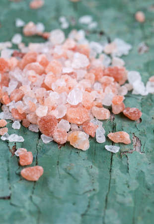 pink salt on old wooden surfaceの写真素材