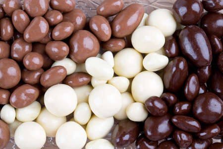 chocolate covered nuts and raisins background