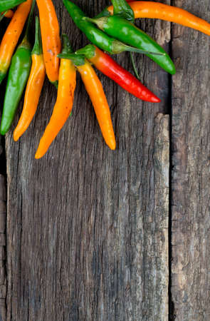 hot pepper on wooden surface