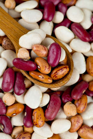 various beans on wooden surface