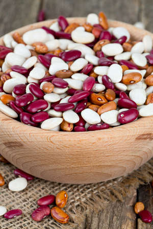 various beans in a wooden bowl