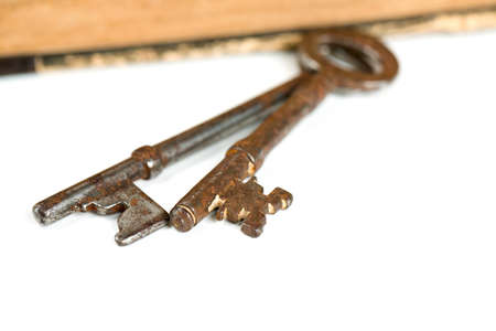 old keys isolated on whiteの写真素材