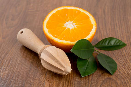 cut oranges on wooden surfce