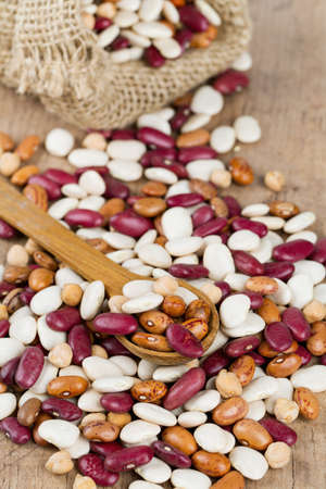 various beans on wooden surface