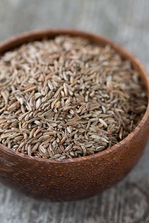 dried cumin on wooden surfaceの写真素材