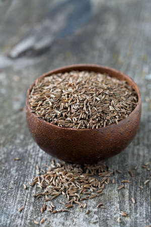 dried cumin on wooden surfaceの写真素材