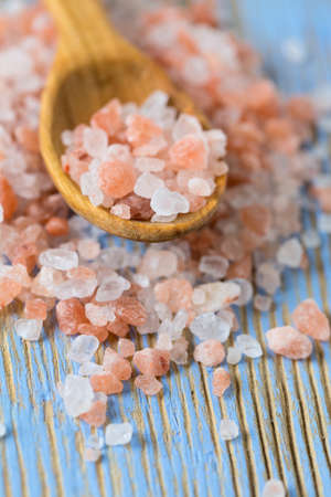 himalayan pink salt on wooden surfaceの写真素材