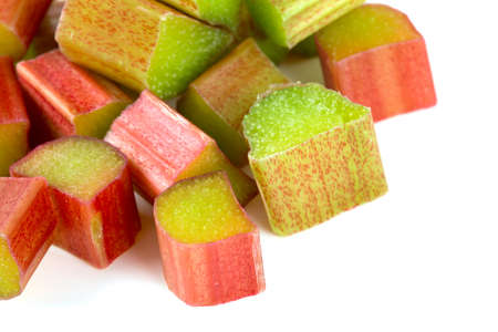 freshly cut pieces of rhubarb isolated on white backgroundの写真素材