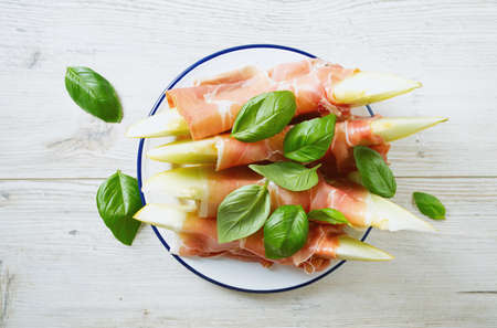 melon and proschiutto with basilの写真素材