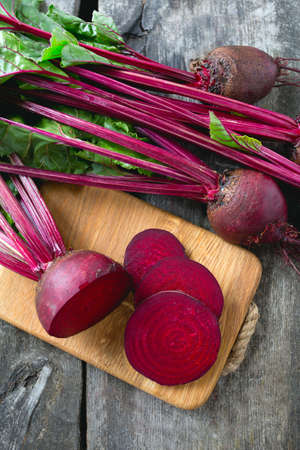 fresh sliced beetroot on wooden surface