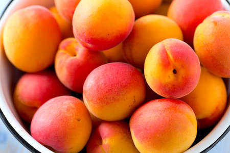 apricots on wooden surfaceの写真素材