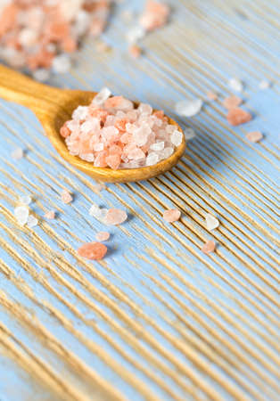 himalayan pink salt on wooden surfaceの写真素材