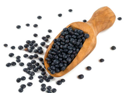 black lentils isolated on whiteの写真素材