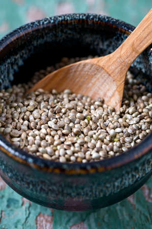 hemp seeds on wooden surfaceの写真素材