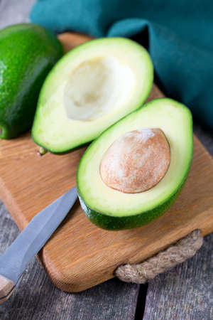 avocado on wooden surface