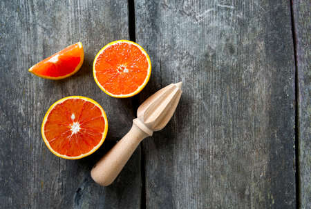 red oranges on wooden surface