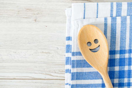smiling spoons and kitchen towelの写真素材