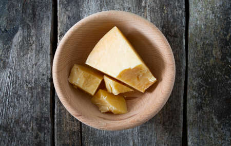 Parmesan cheese in a wooden bowlの写真素材
