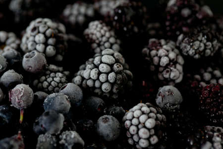 frozen blueberries and blackberriesの写真素材