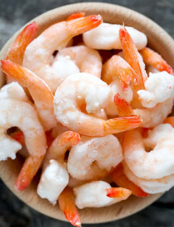 frozen shrimps on wooden surfaceの写真素材