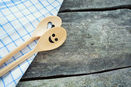 wooden spoons on kitchen tableの写真素材