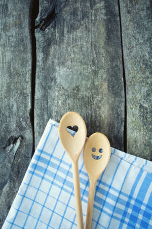 wooden spoons on kitchen tableの写真素材