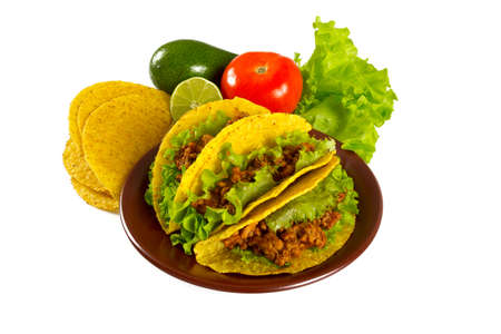 plate with tacos and nachos isolated on whiteの写真素材