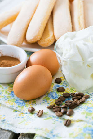 tiramisu ingredients on wooden surfaceの写真素材