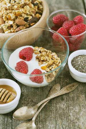 healthy snack - granola on wooden surfaceの写真素材