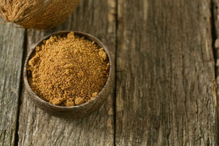 coconut palm sugar on wooden surfaceの写真素材