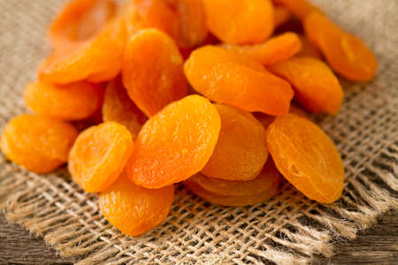 dried apricots on wooden tableの写真素材