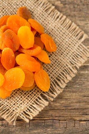 dried apricots on wooden tableの写真素材