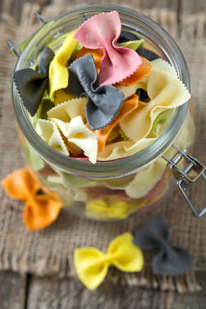 colorful pasta on wooden surface