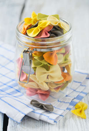 colorful pasta on wooden surface