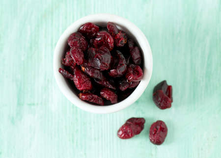cranberry on wooden surface