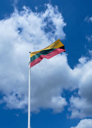 Lithuania's flag over cloudy skyの写真素材
