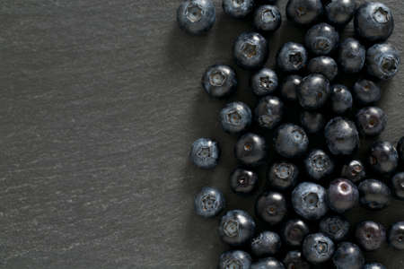 blueberries on stone boardの写真素材